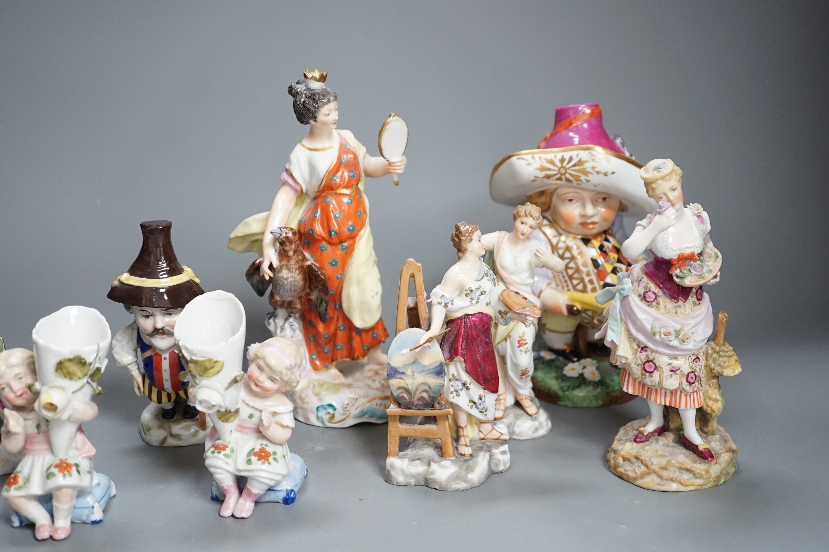 A selection of mainly Continental porcelain figures including Royal Crown Derby style mansion house dwarf